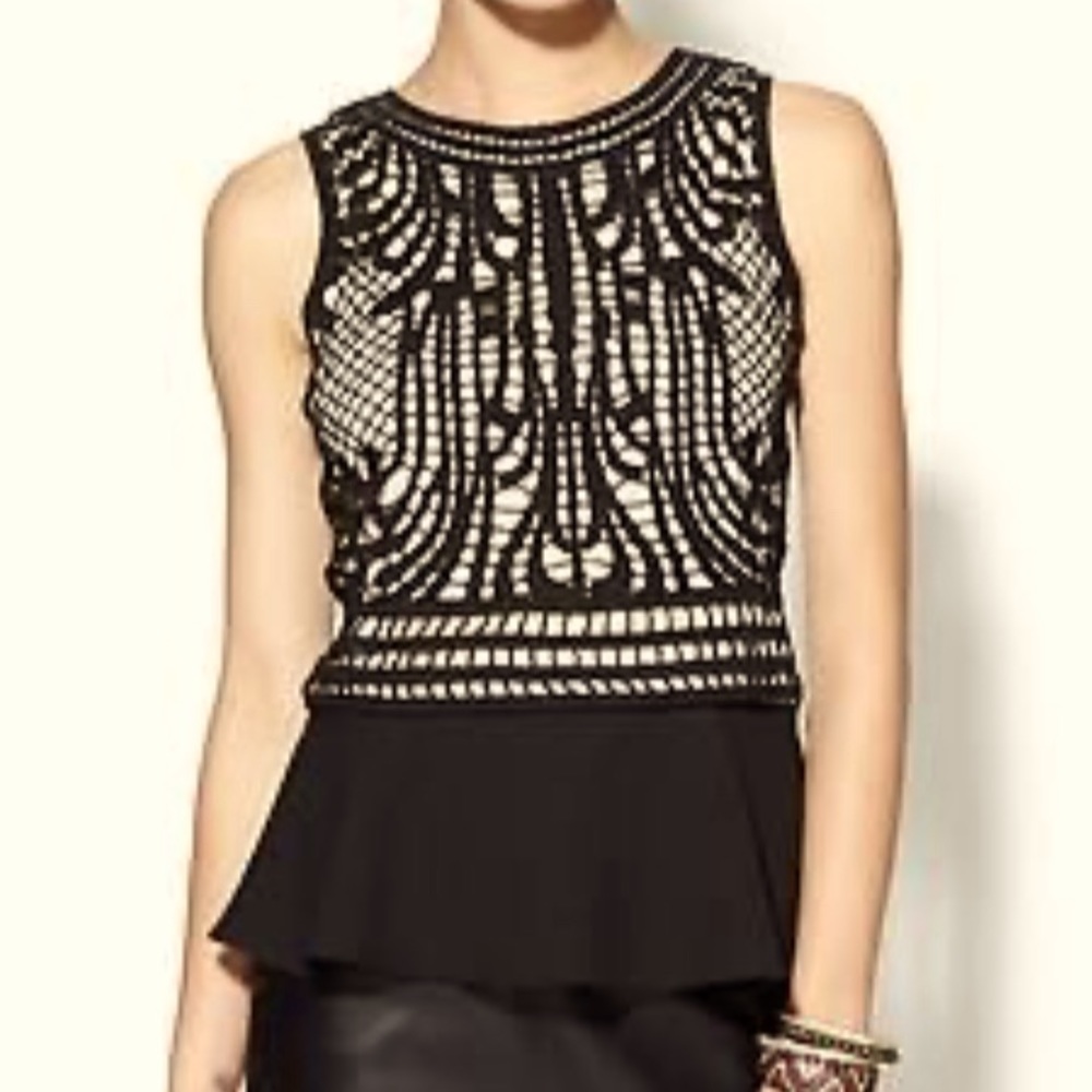 Boutique- purchased, black and tan peplum-style tank.